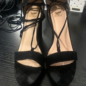Black strap up heels